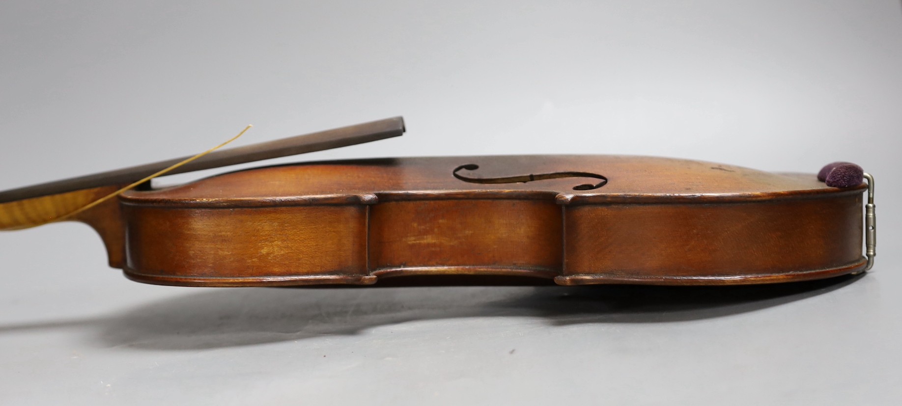 A cased 19th century violin, labelled Stradivarius 1690, with a Dodd bow